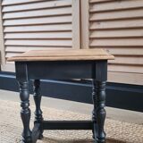 Nest tables in wood and black.