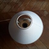 Antique ceramic lamp with a floral design.