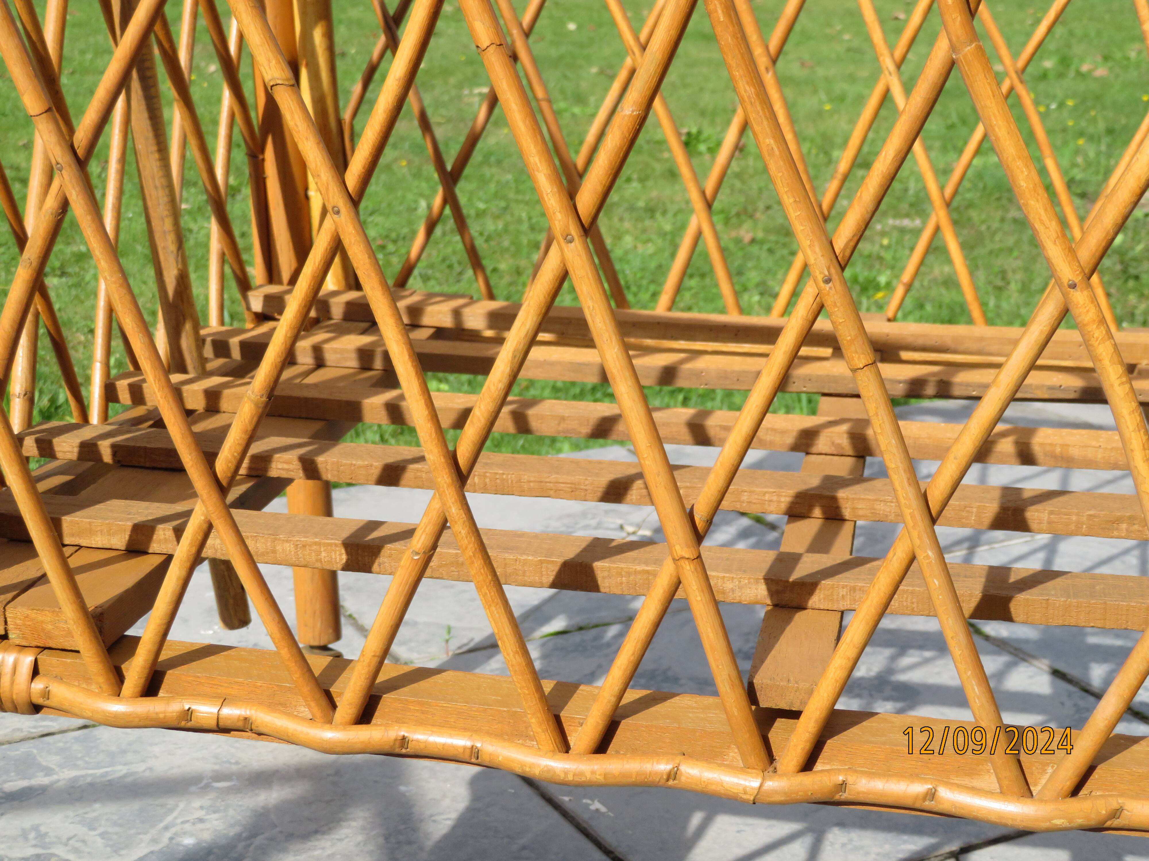 antique rattan children's bed with arrow
