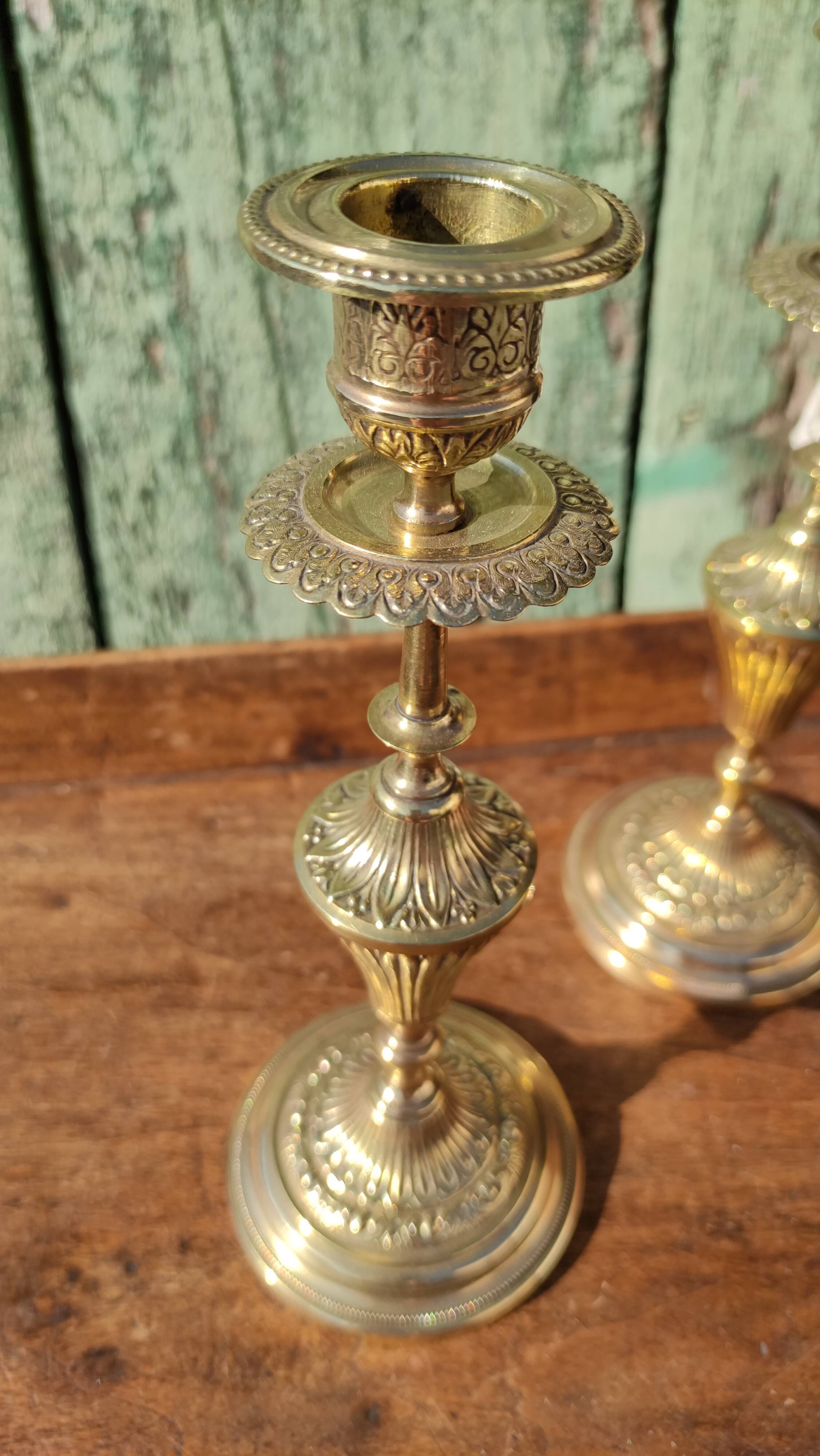 Pair of chiseled brass candle holders