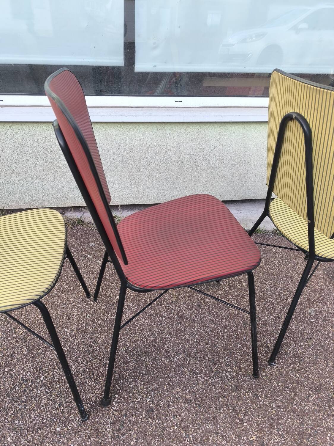 Set of 3 vintage yellow and red faux leather chairs.