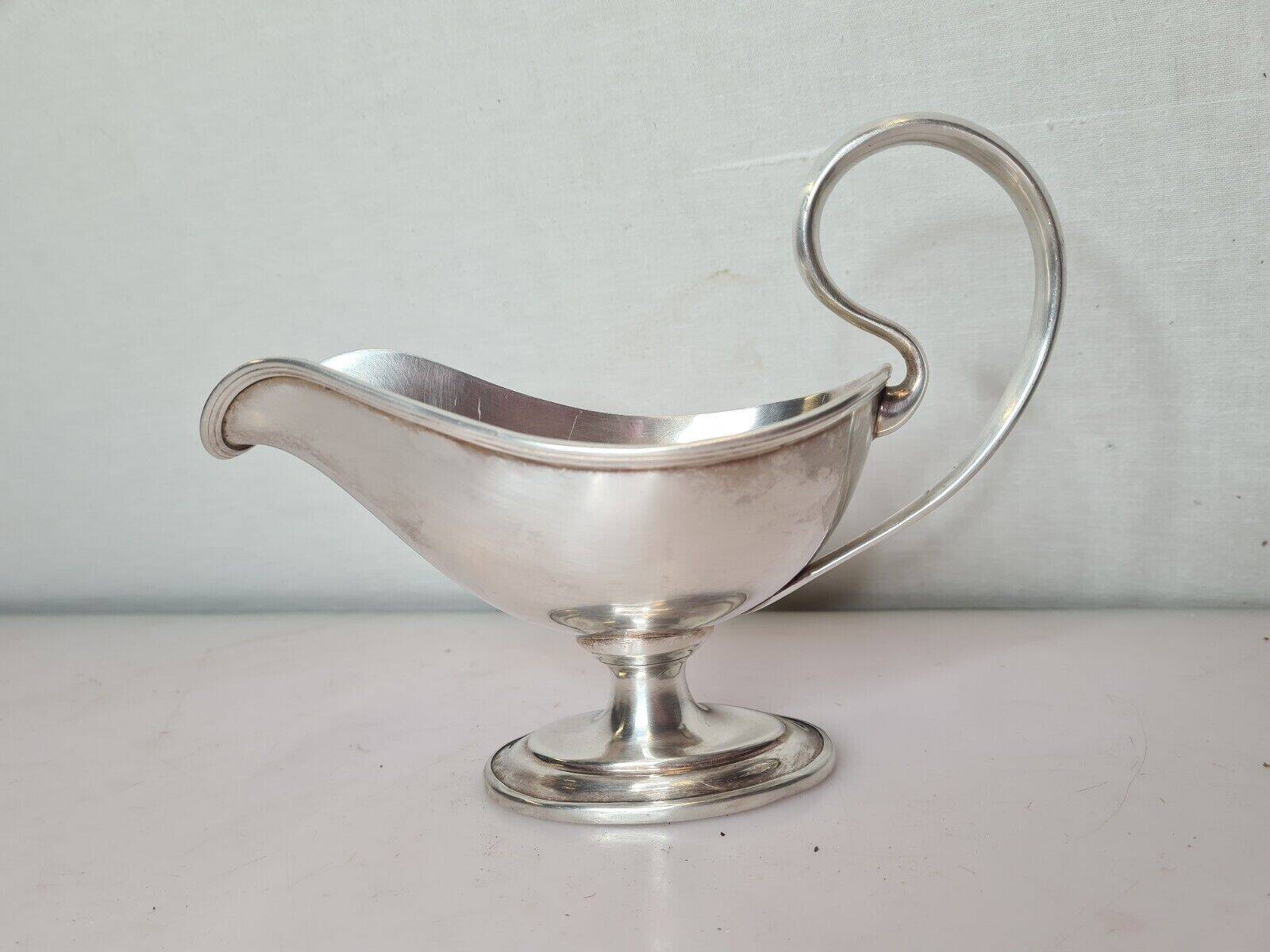 silver metal gravy boat