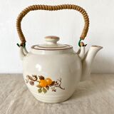 Vintage porcelain and rattan teapot