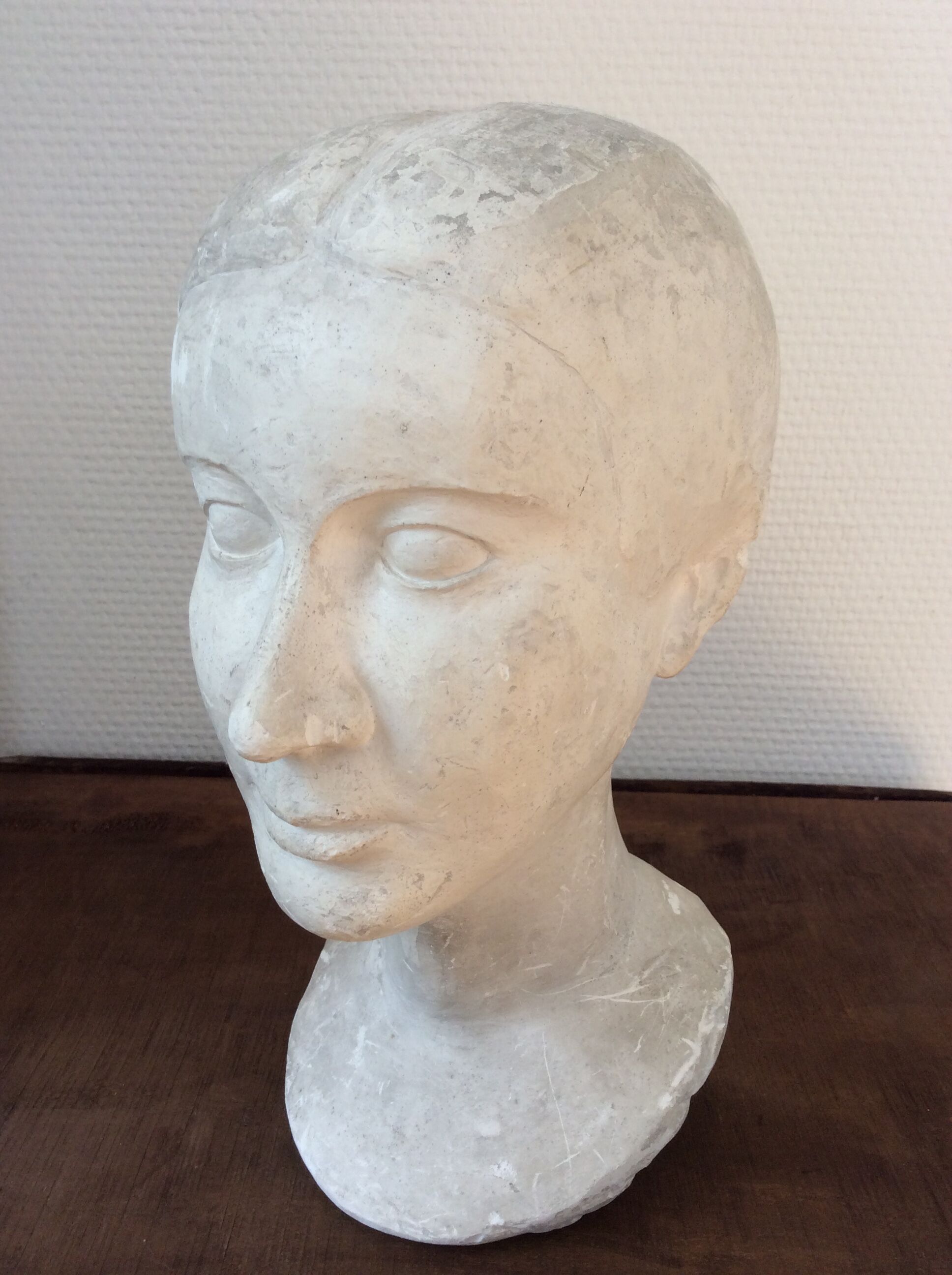 Plaster young woman at the bun