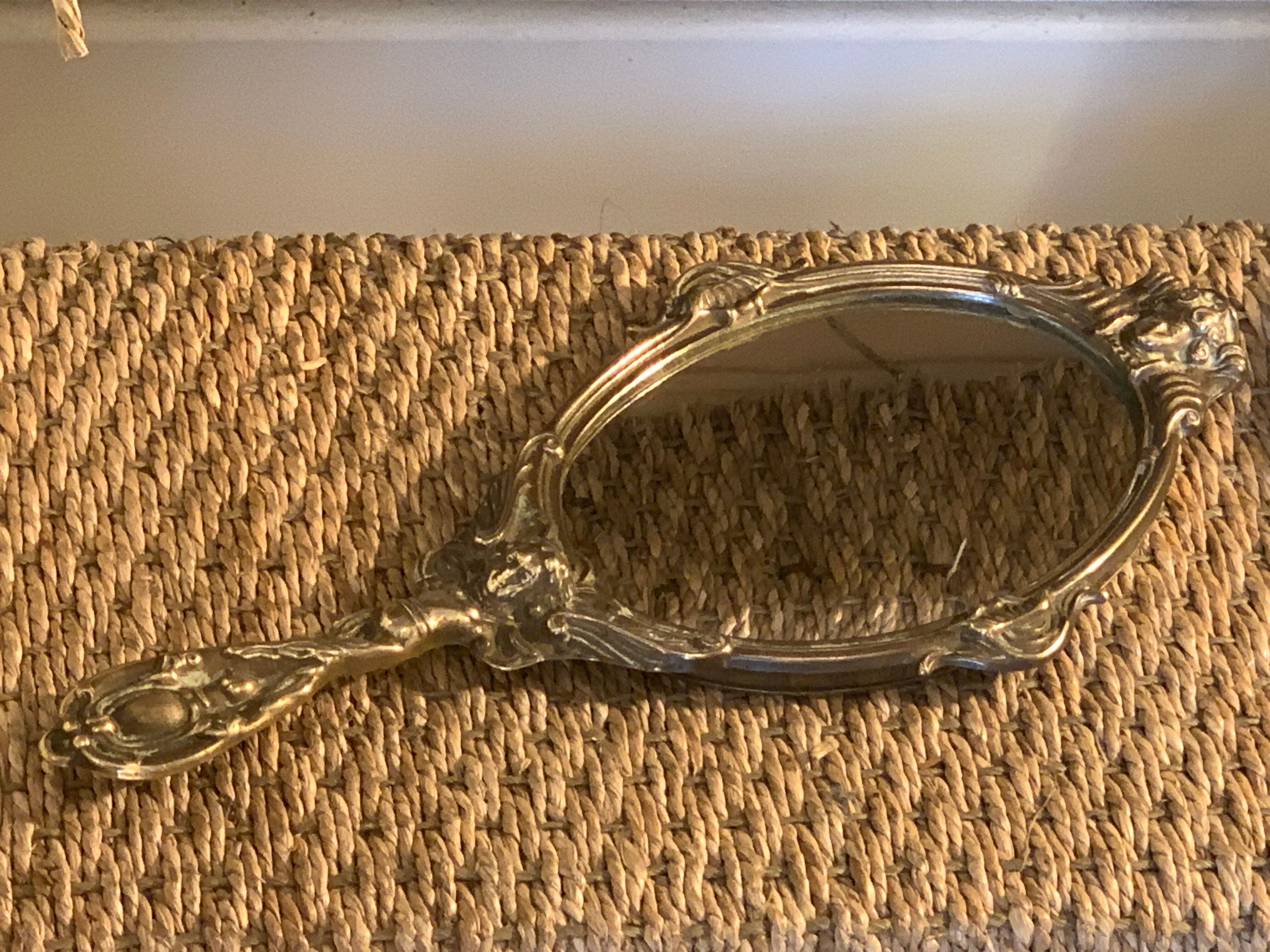 Bronze hand-facing mirror, early twentieth century, Louis XV style, 29 x 13 cm
