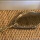 Bronze hand-facing mirror, early twentieth century, Louis XV style, 29 x 13 cm