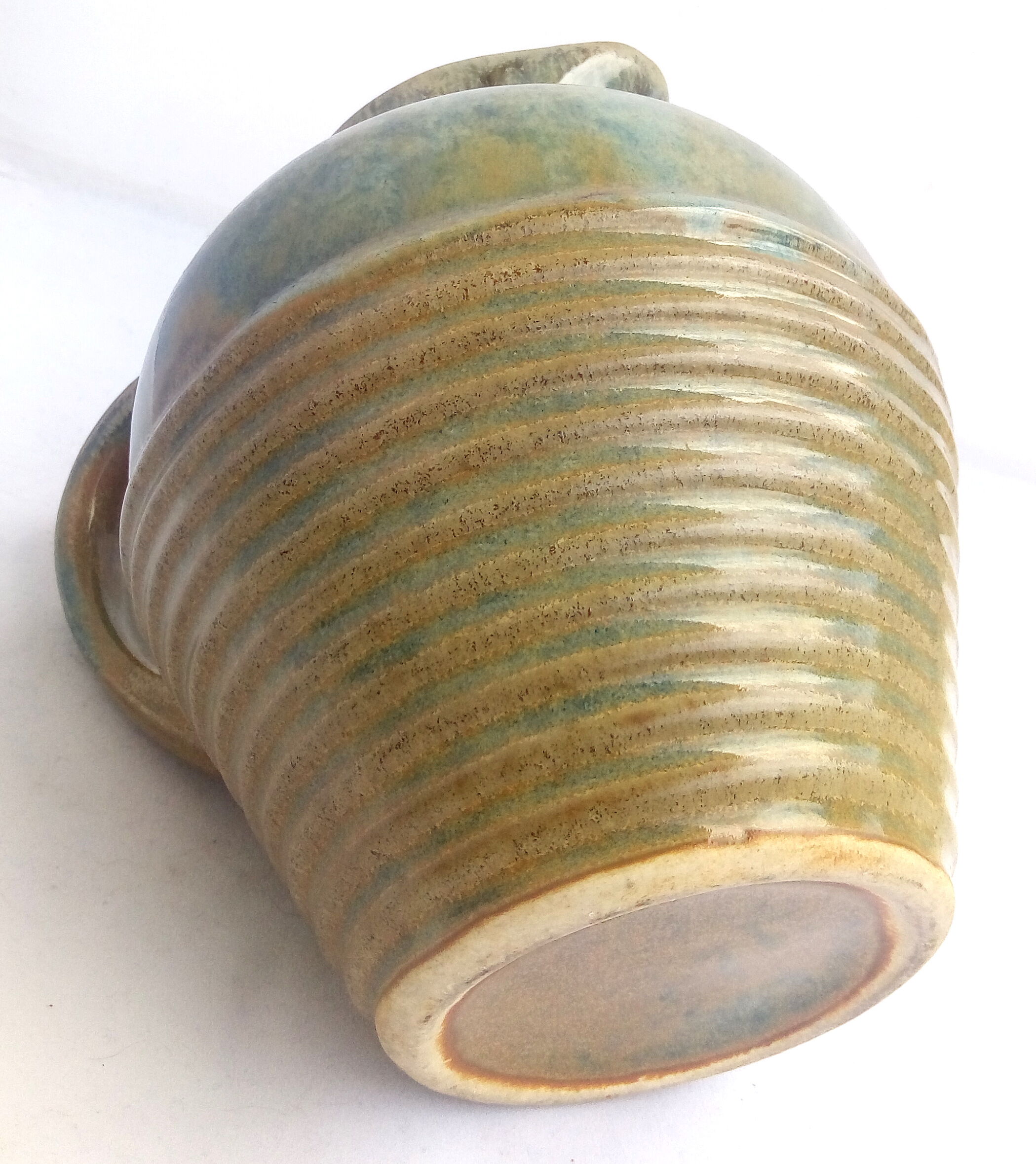 Blue enamelled sandstone pitcher and ochre streaks
