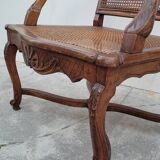 Louis XV Regency cane armchair leather armrests decorated with shell