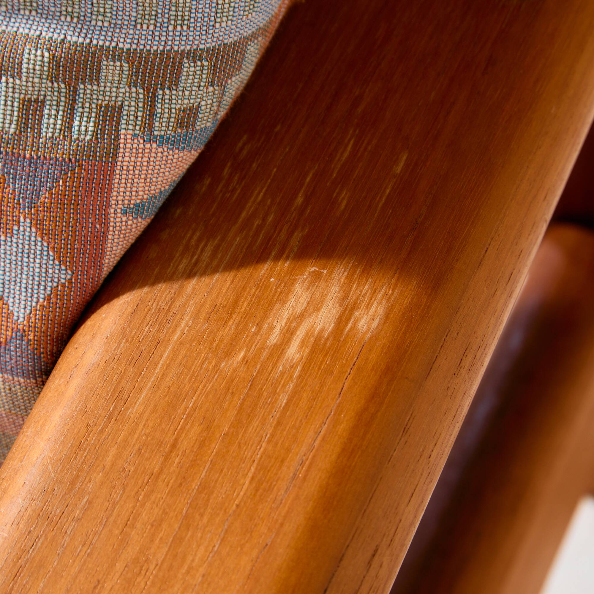 Three-seater teak sofa