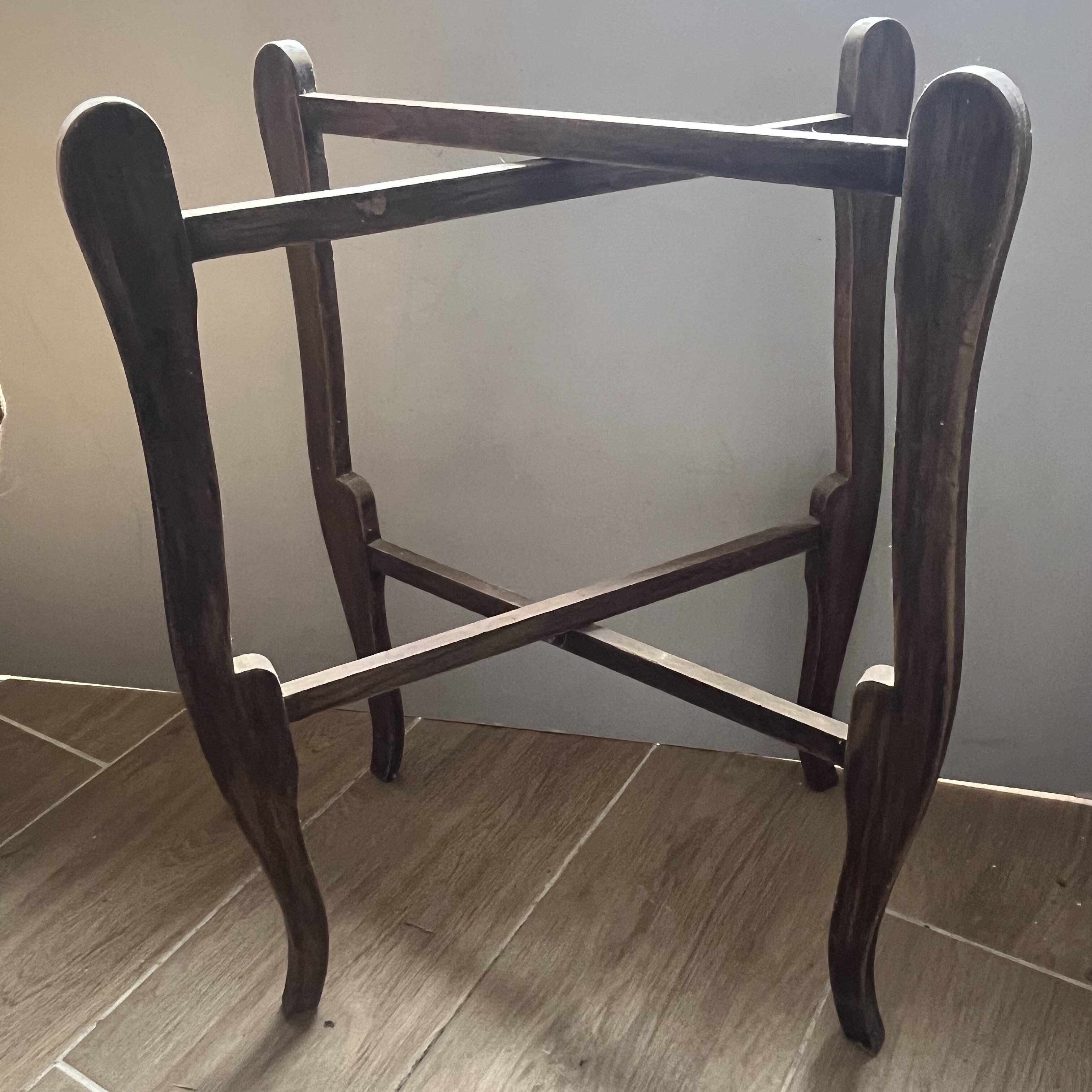 Two old trays on a stand/console.
