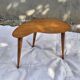 Vintage Scandinavian bean side table with wooden tapered legs.