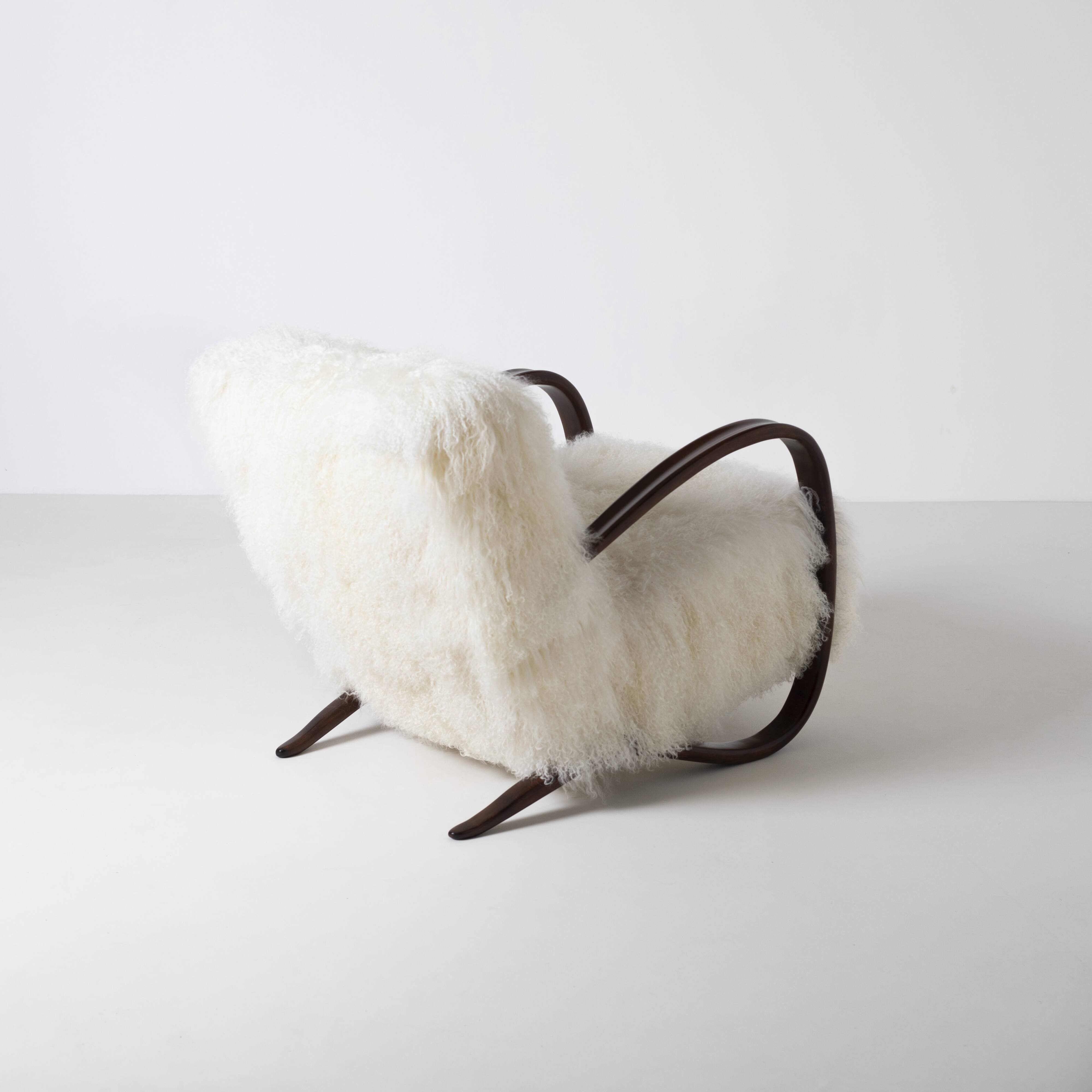 Pair of Jindrich Halabala H 269 lounge chairs in mongolian sheepskin