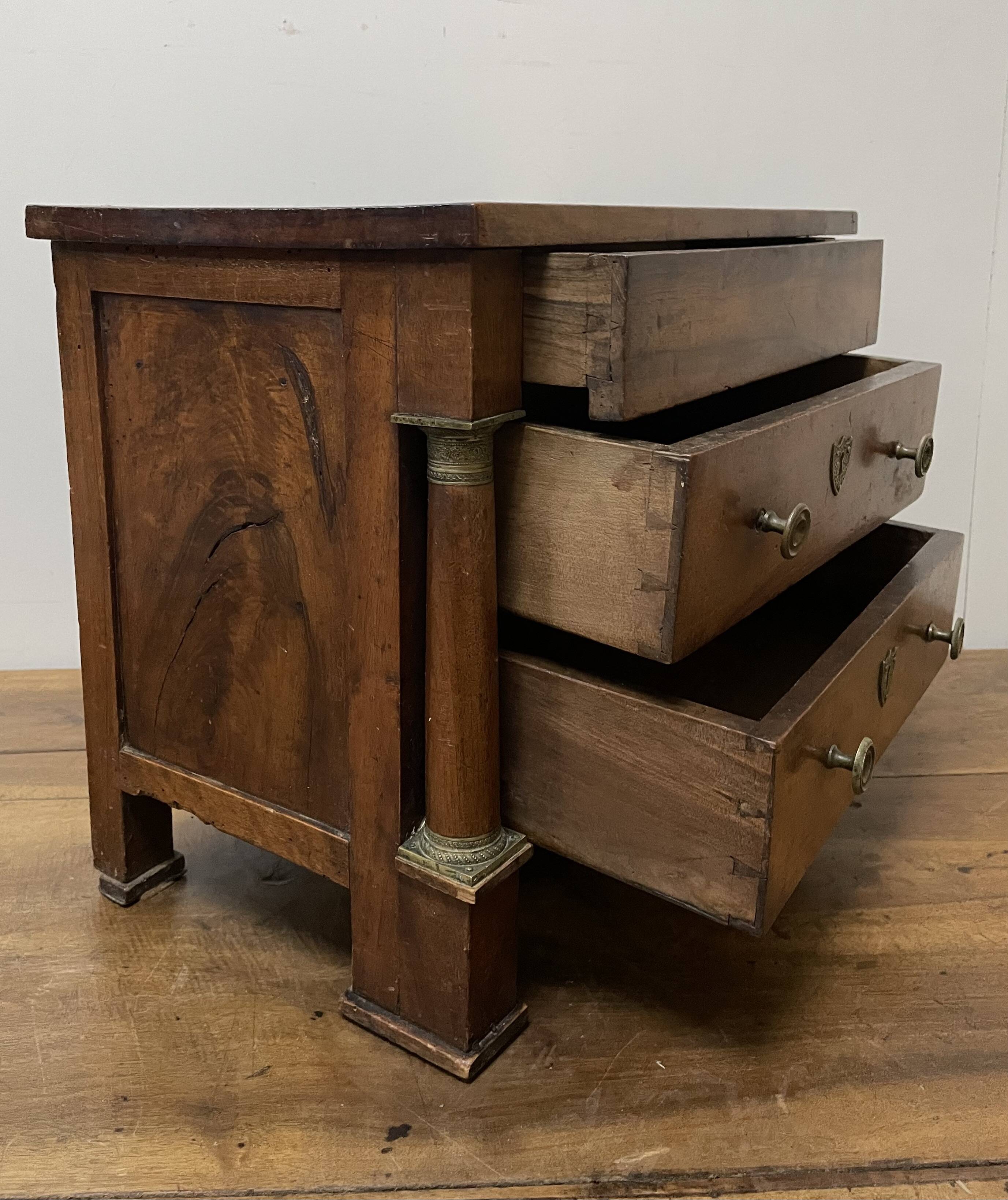 19th century Empire style walnut chest of drawers. It opens with 3 drawers in