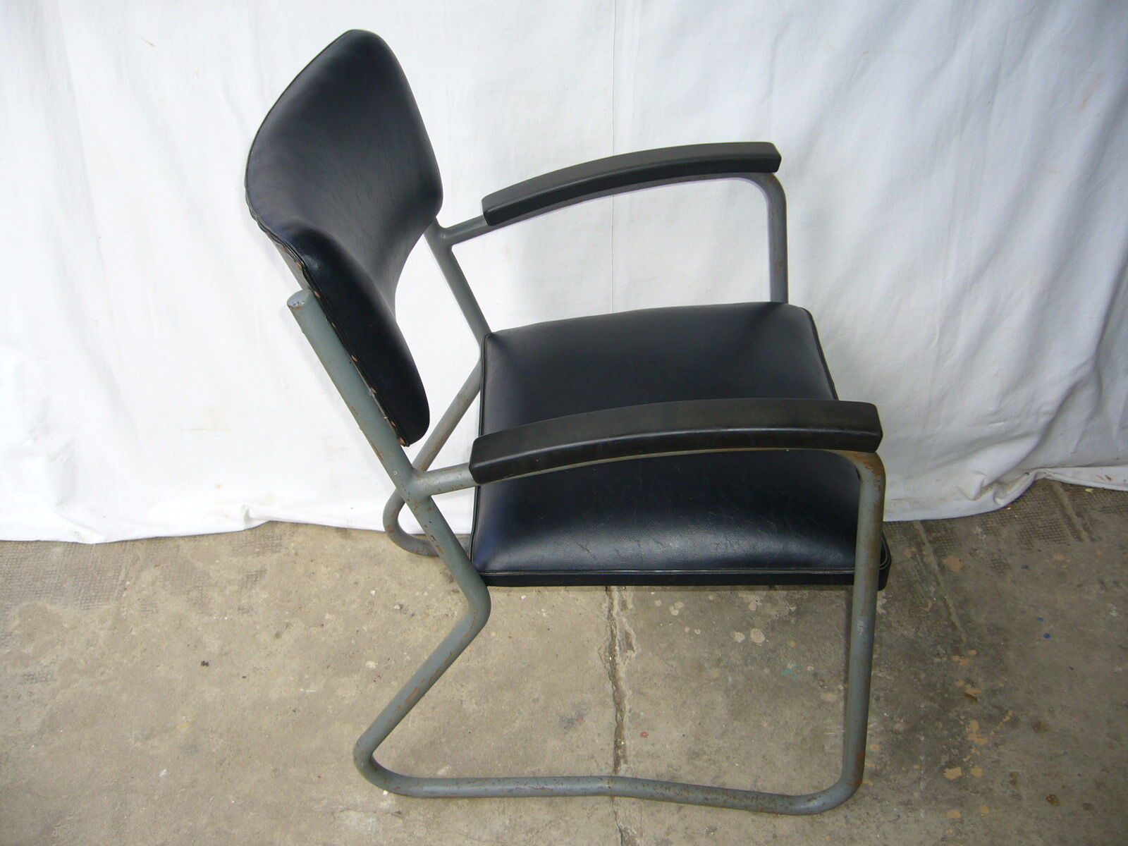 Old industrial chair in skai and metal