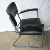 Old industrial chair in skai and metal