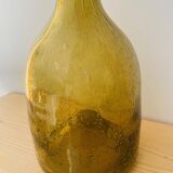 Amber colored Biot bubble glass bottle