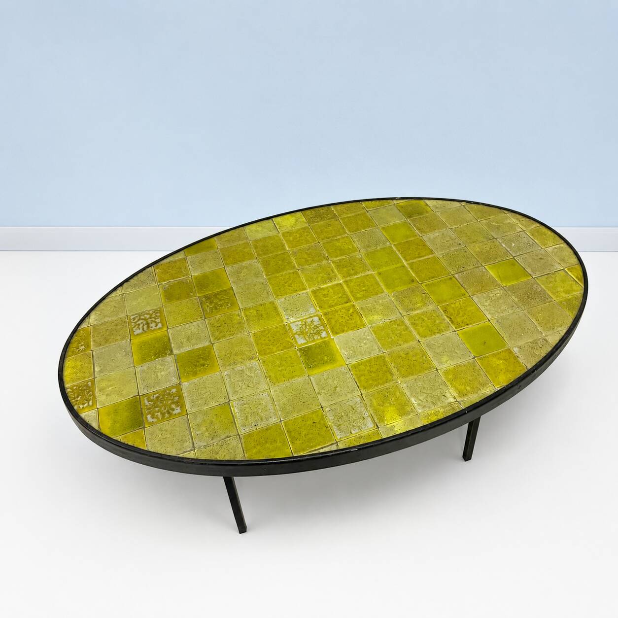 Oval coffee table in glazed ceramic and black metal, DLG by Mado Jolain.