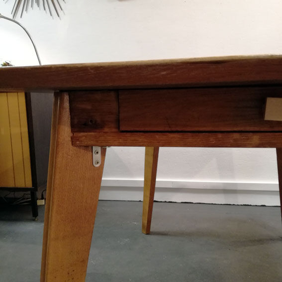 Dining table with compass feet