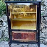 Mahogany display case with gilded brass decoration