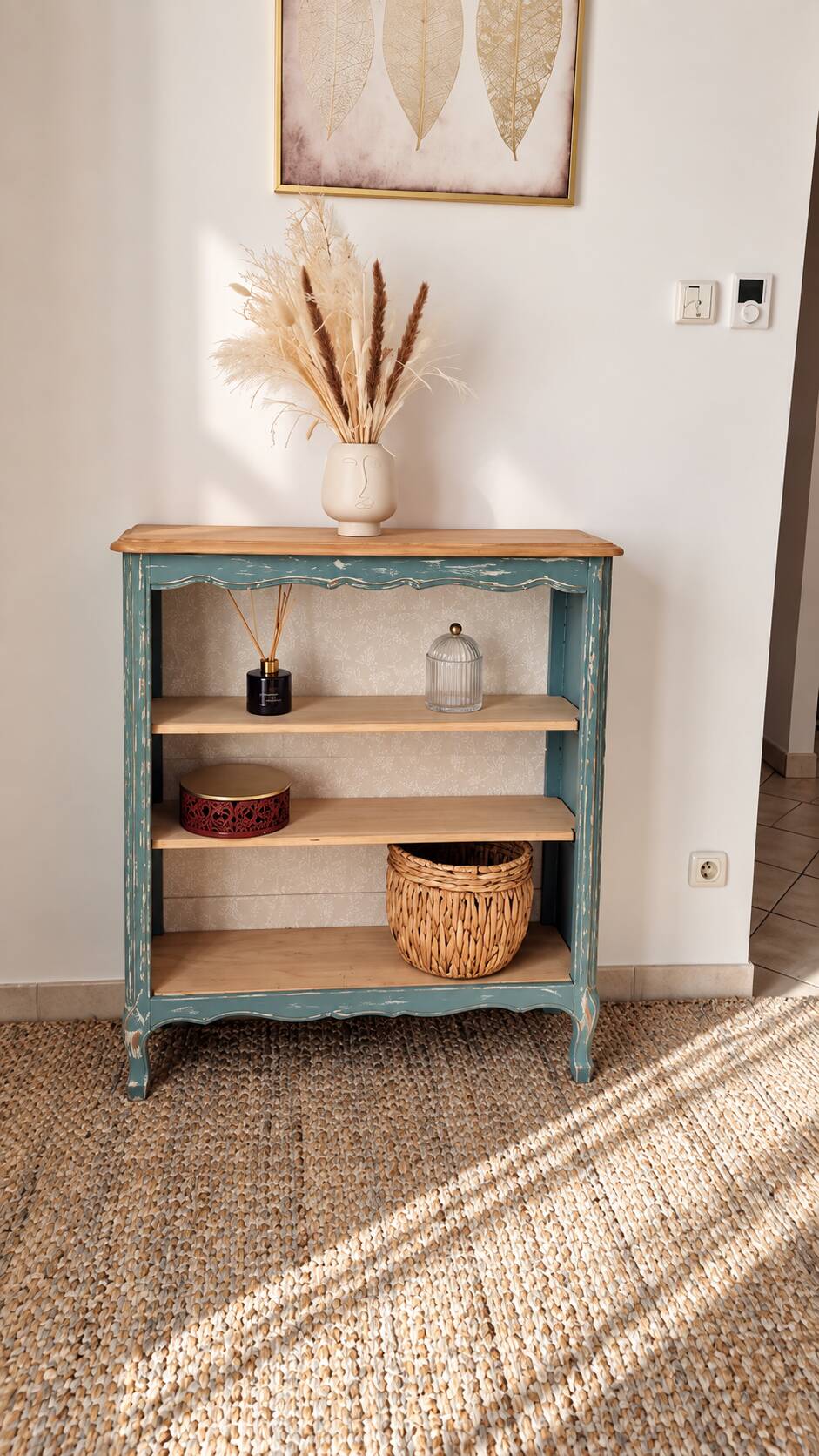 Antique wooden bookshelf with a patinated blue-green finish.