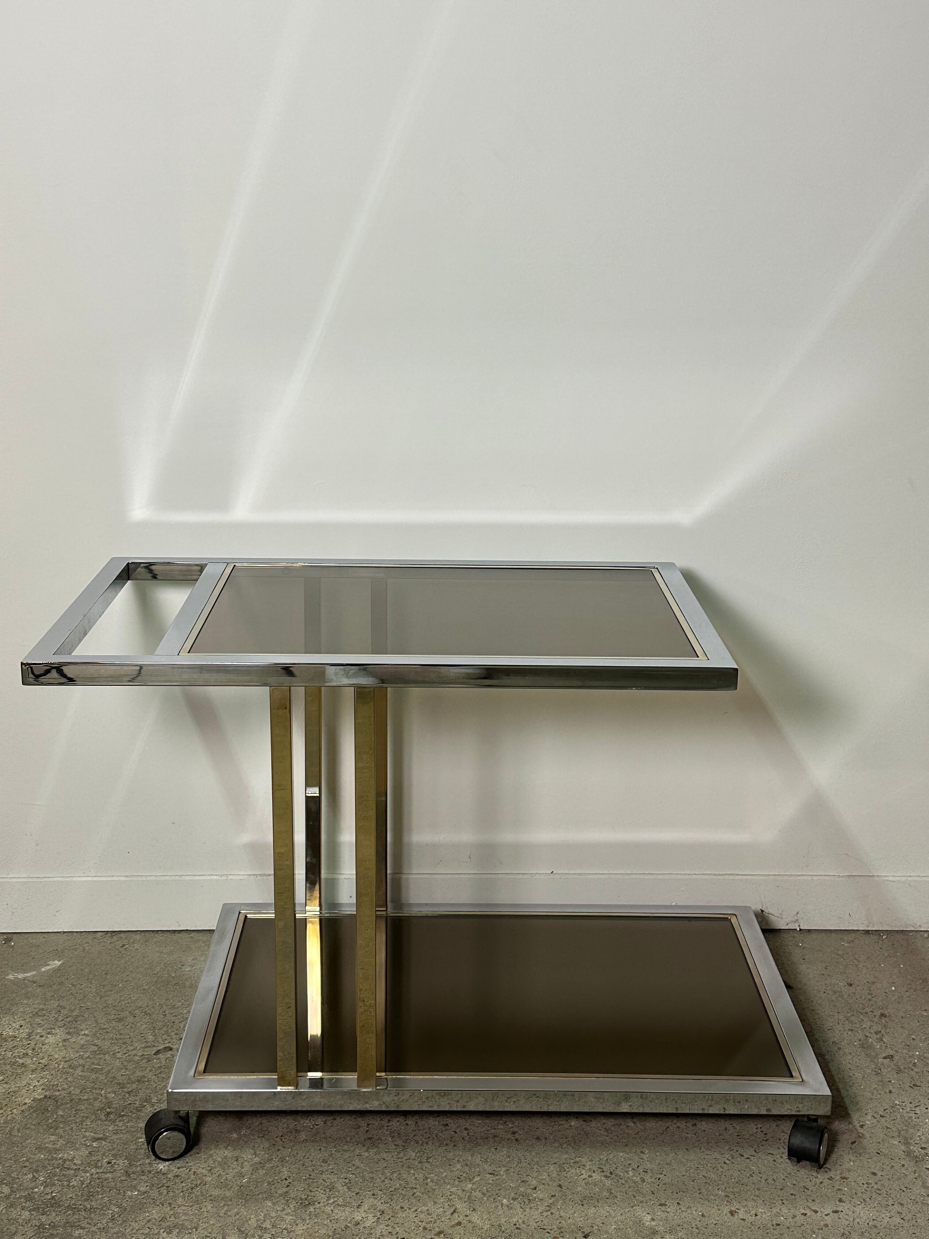 Belgo chrome serving cart/rolling table in chromed and gold-plated brass, 70s