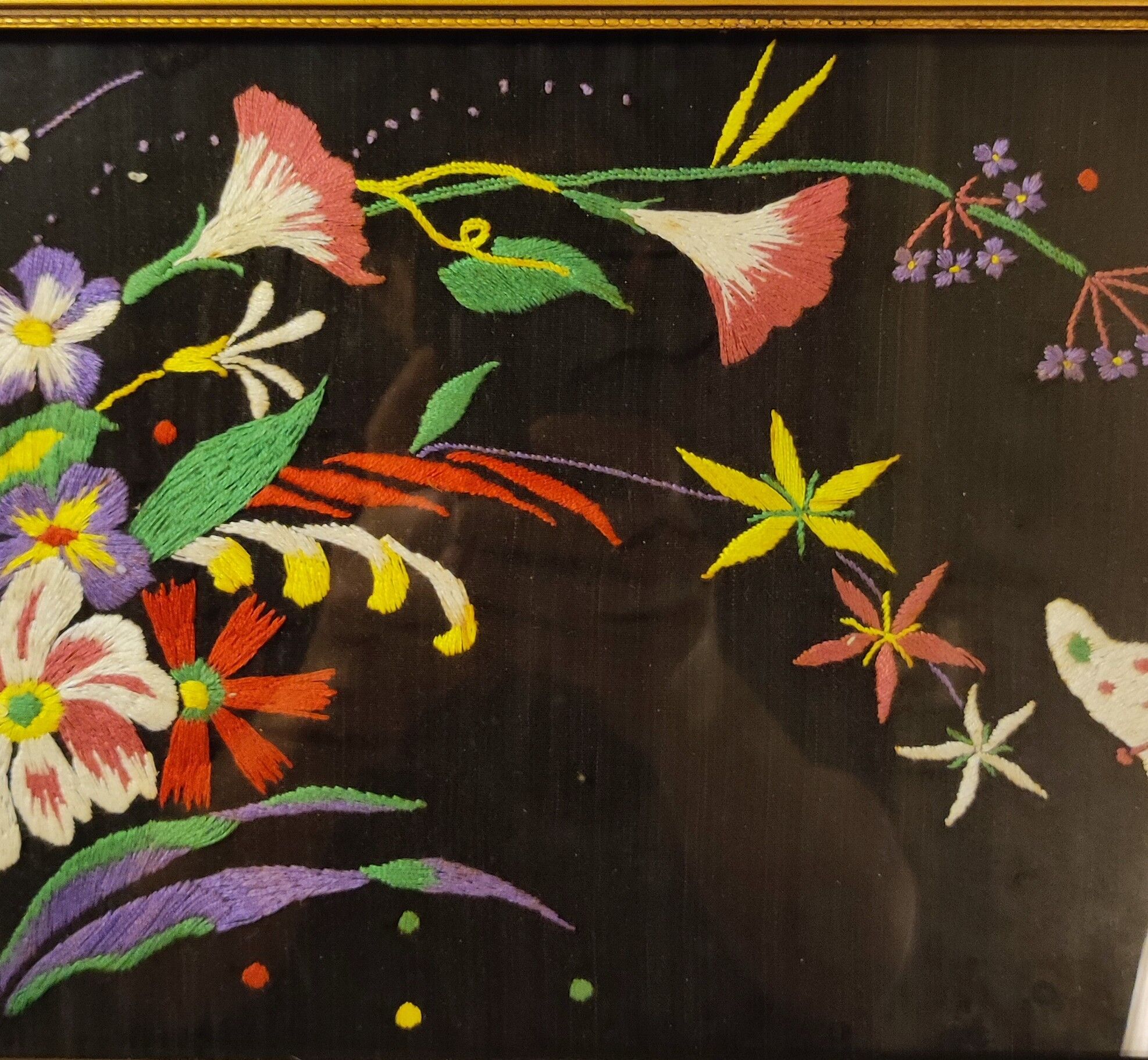 Floral embroidery on black silk framed 1950