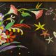 Floral embroidery on black silk framed 1950