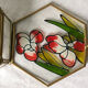 Glass box and hexagonal brass enamelled floral decoration