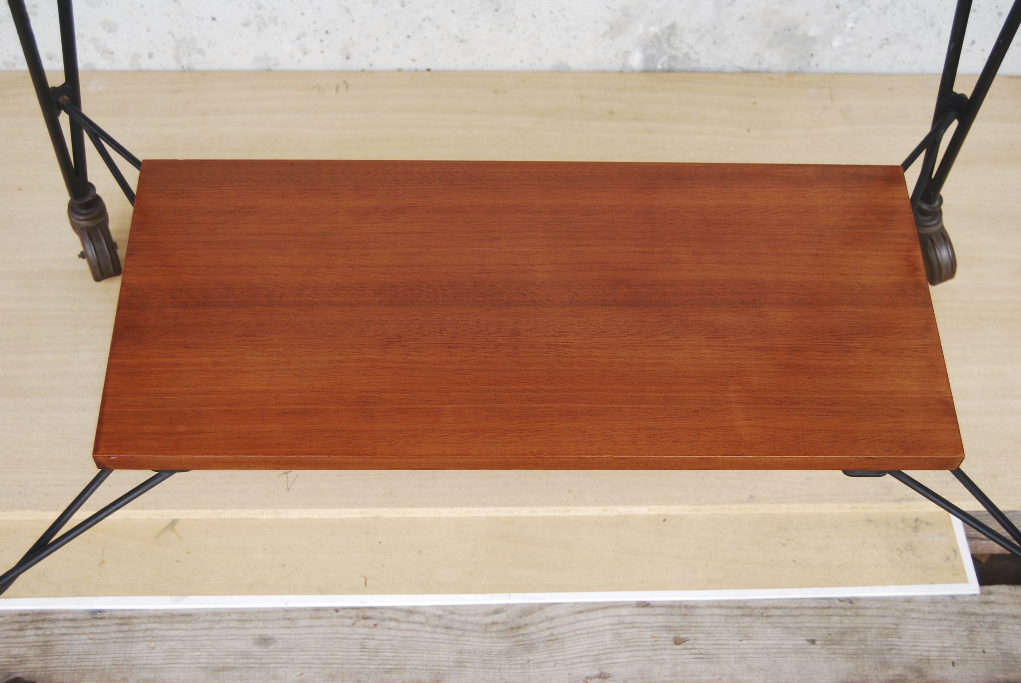 Tv furniture, a table with teak wheels and Scandinavian-style metal.