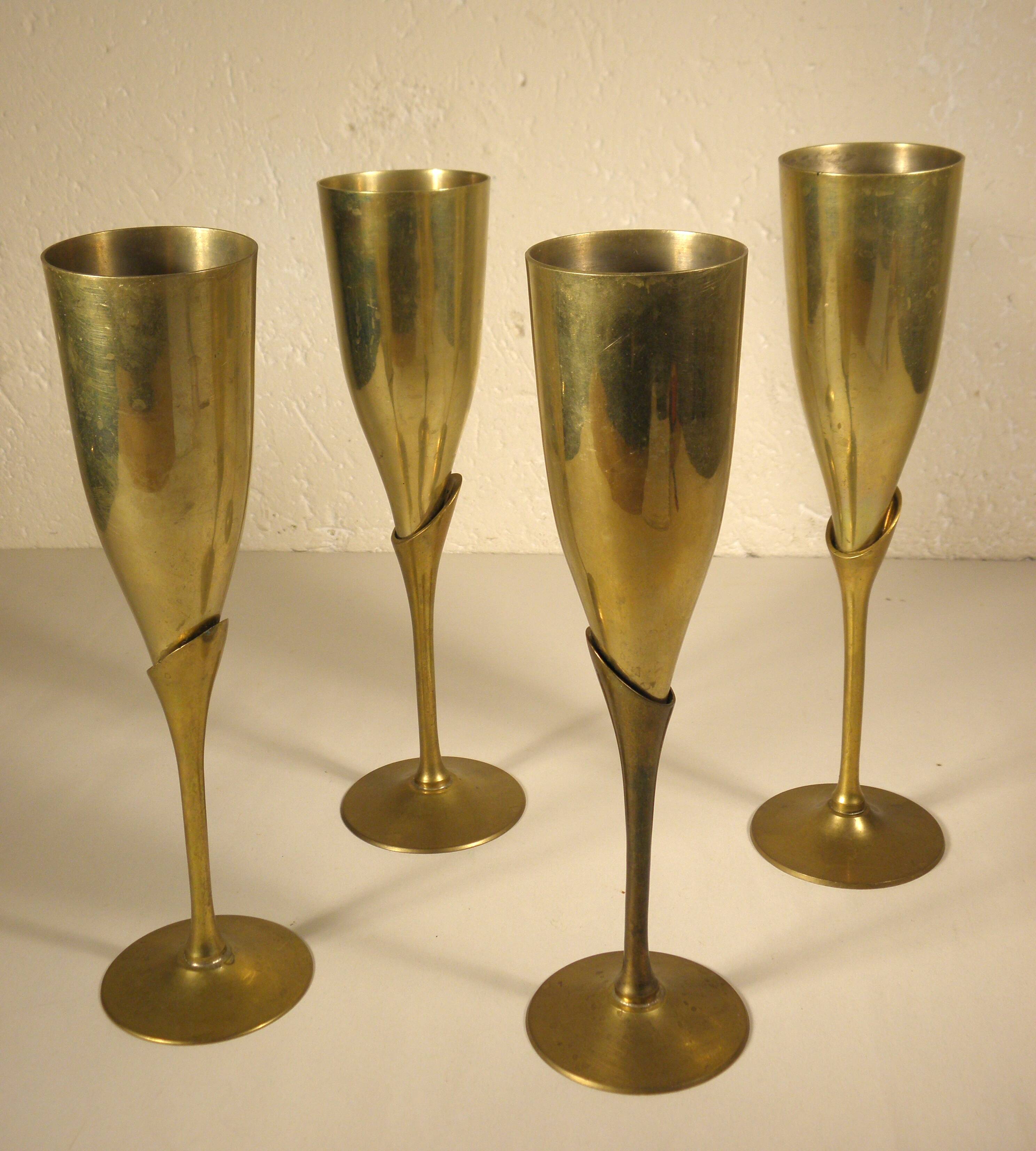 4 flutes, brass champagne glasses