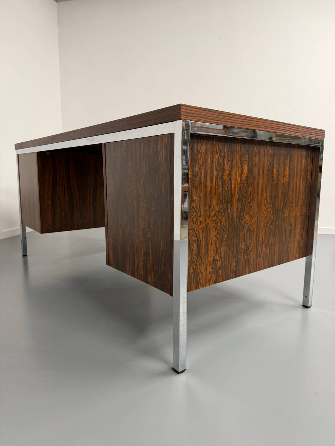 Vintage desk with rosewood veneer and chrome metal design from the 1970s.
