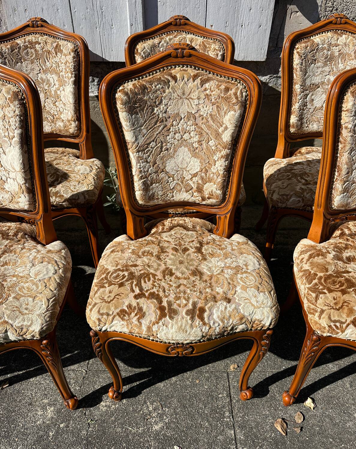 8 cherry wood chairs in Louis XV style with velvet upholstery.