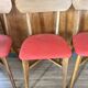 Set of 4 wooden chairs with red vinyl.