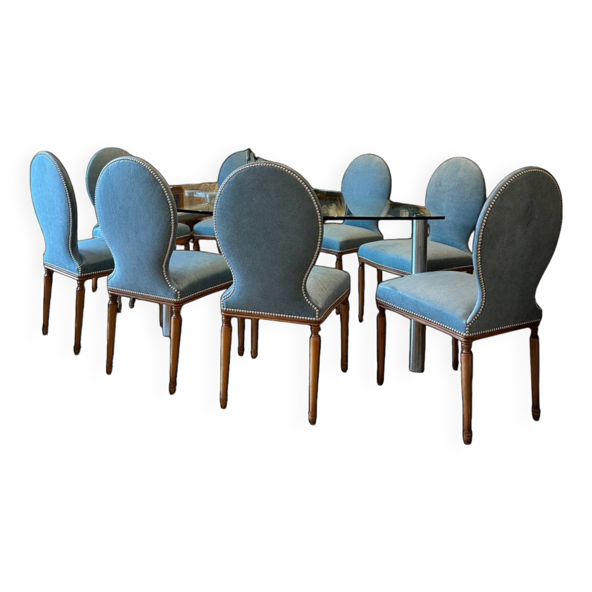 Table ghibli en verre avec 8 chaises parisiennes pieds sabrés roche bobois