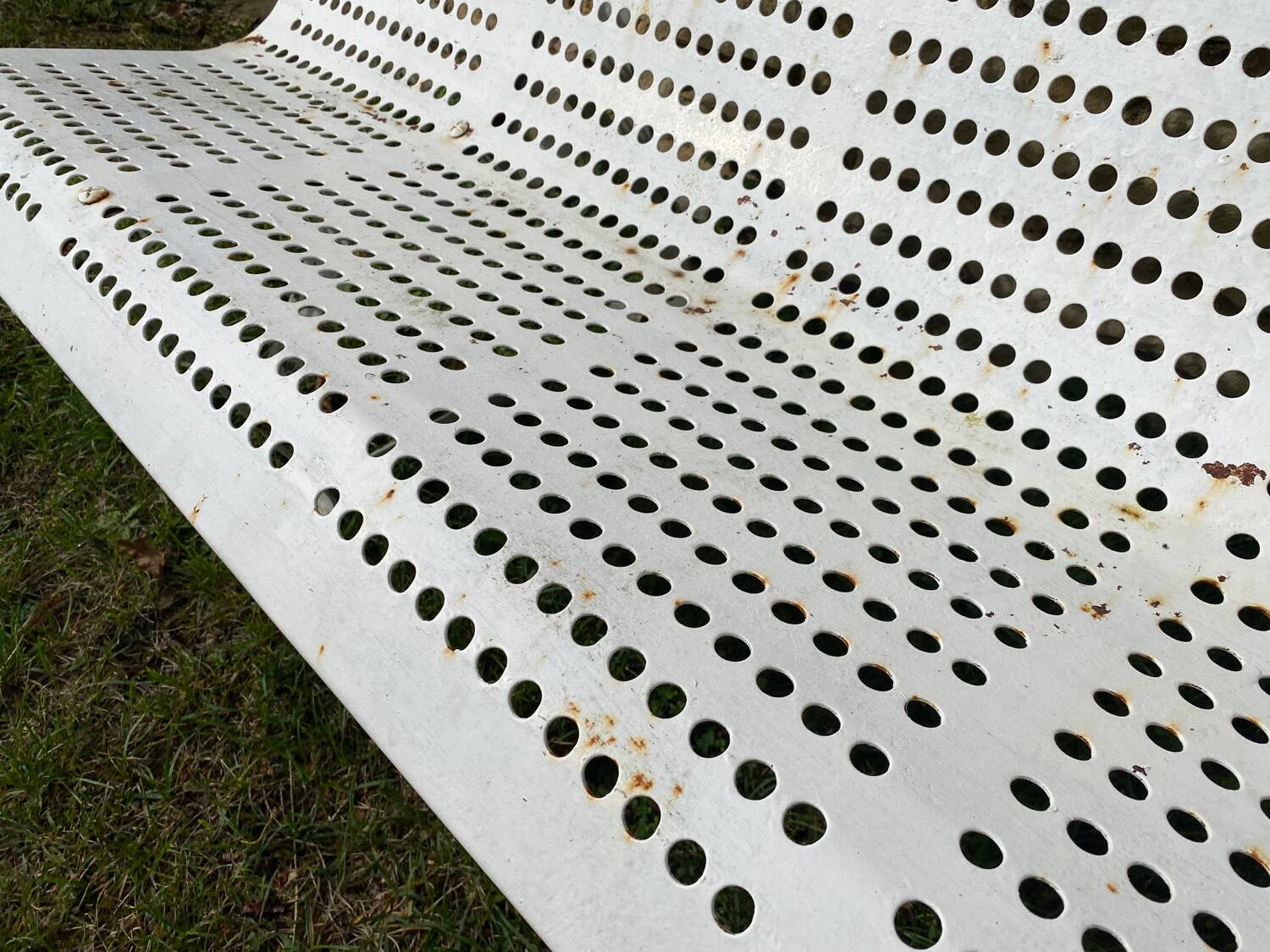 White bench in public garden or park
