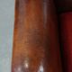 Sheepskin leather wingback chair with a red corduroy seat cushion