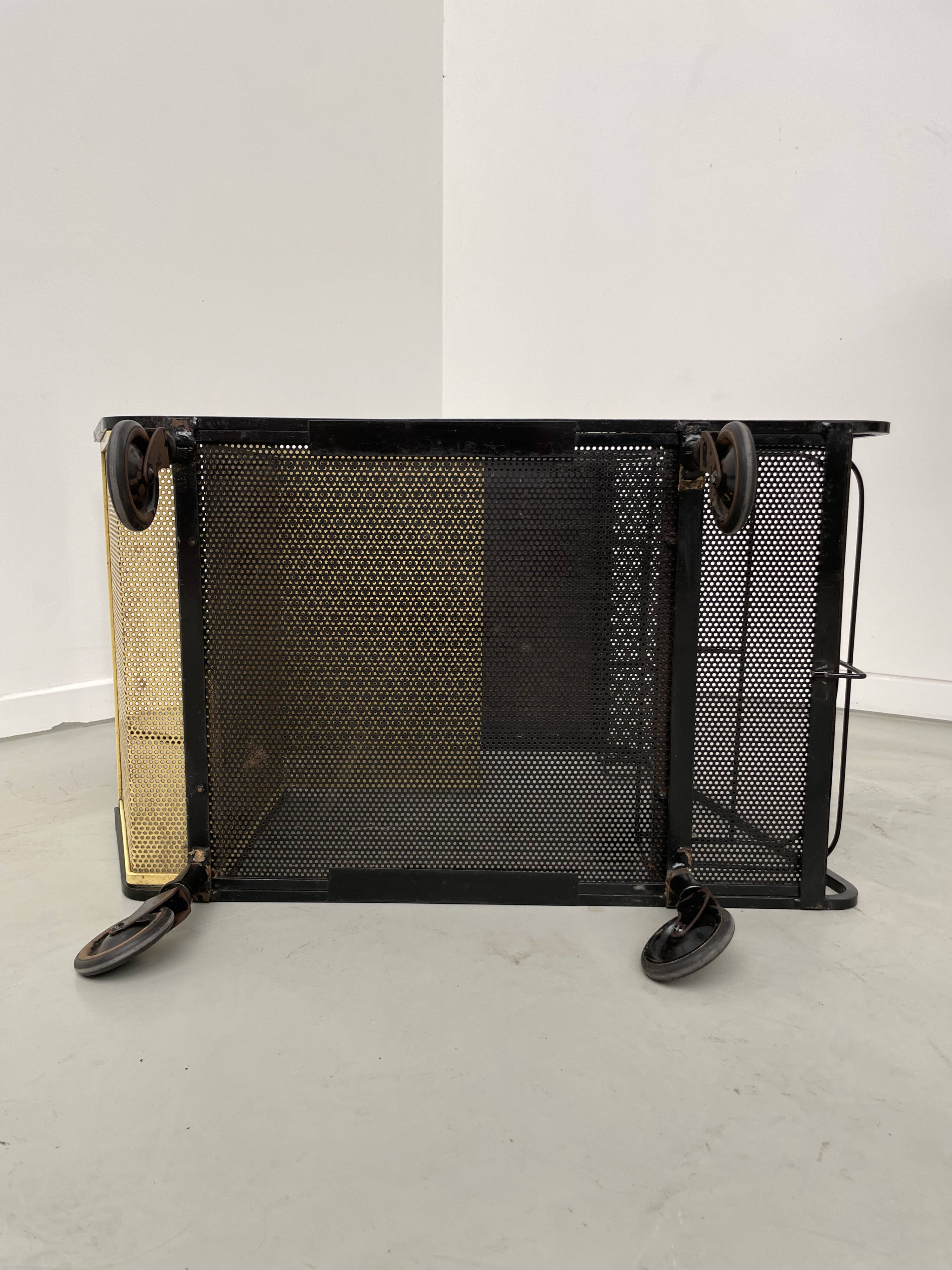 Perforated metal serving trolley in the Mathieu Matégot style