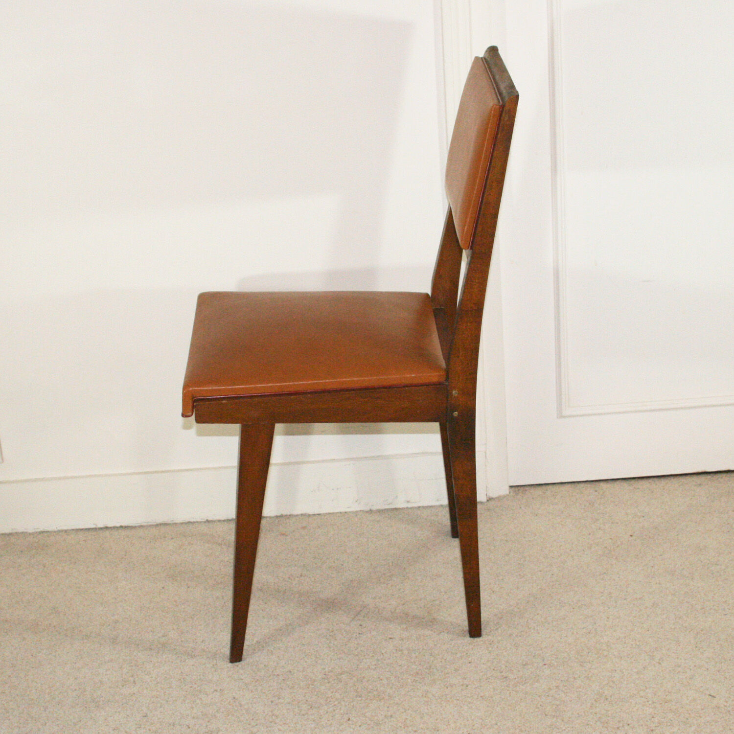Set of four chairs in wood and leatherette
