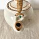 Vintage porcelain and rattan teapot