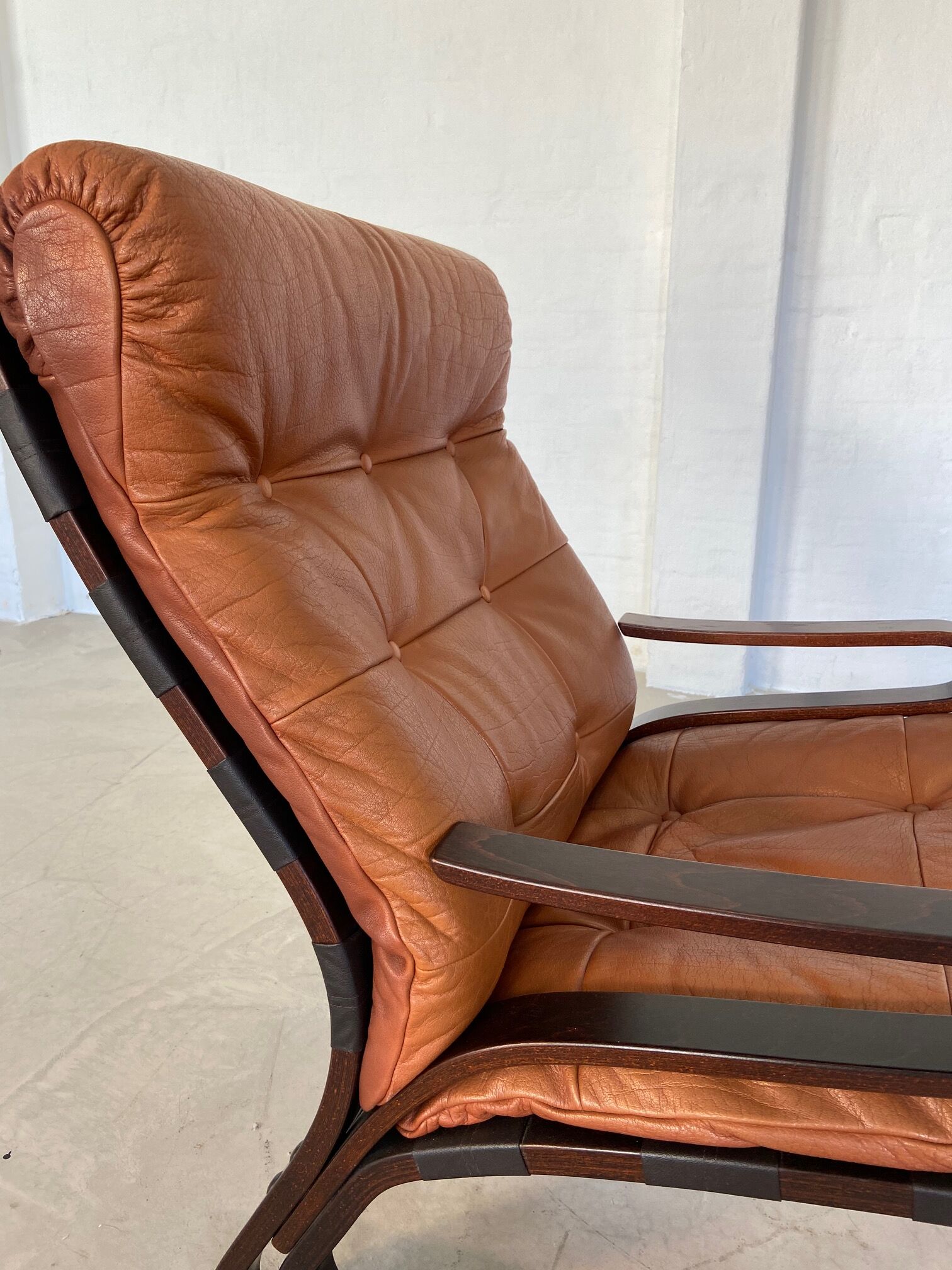 Vintage Scandinavian cognac lounge chair by Oddvin Rykken