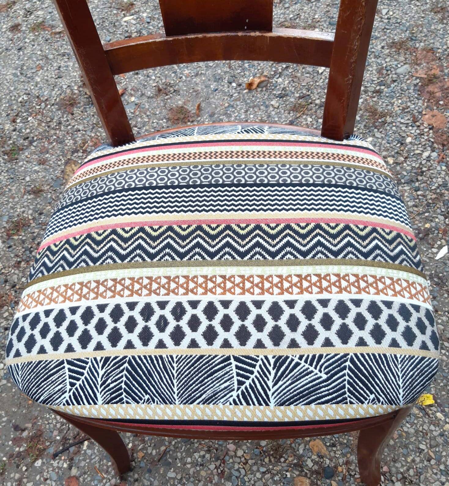 2 varnished solid wood chairs with "ethnic" padding