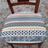 2 varnished solid wood chairs with "ethnic" padding
