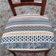 2 varnished solid wood chairs with "ethnic" padding