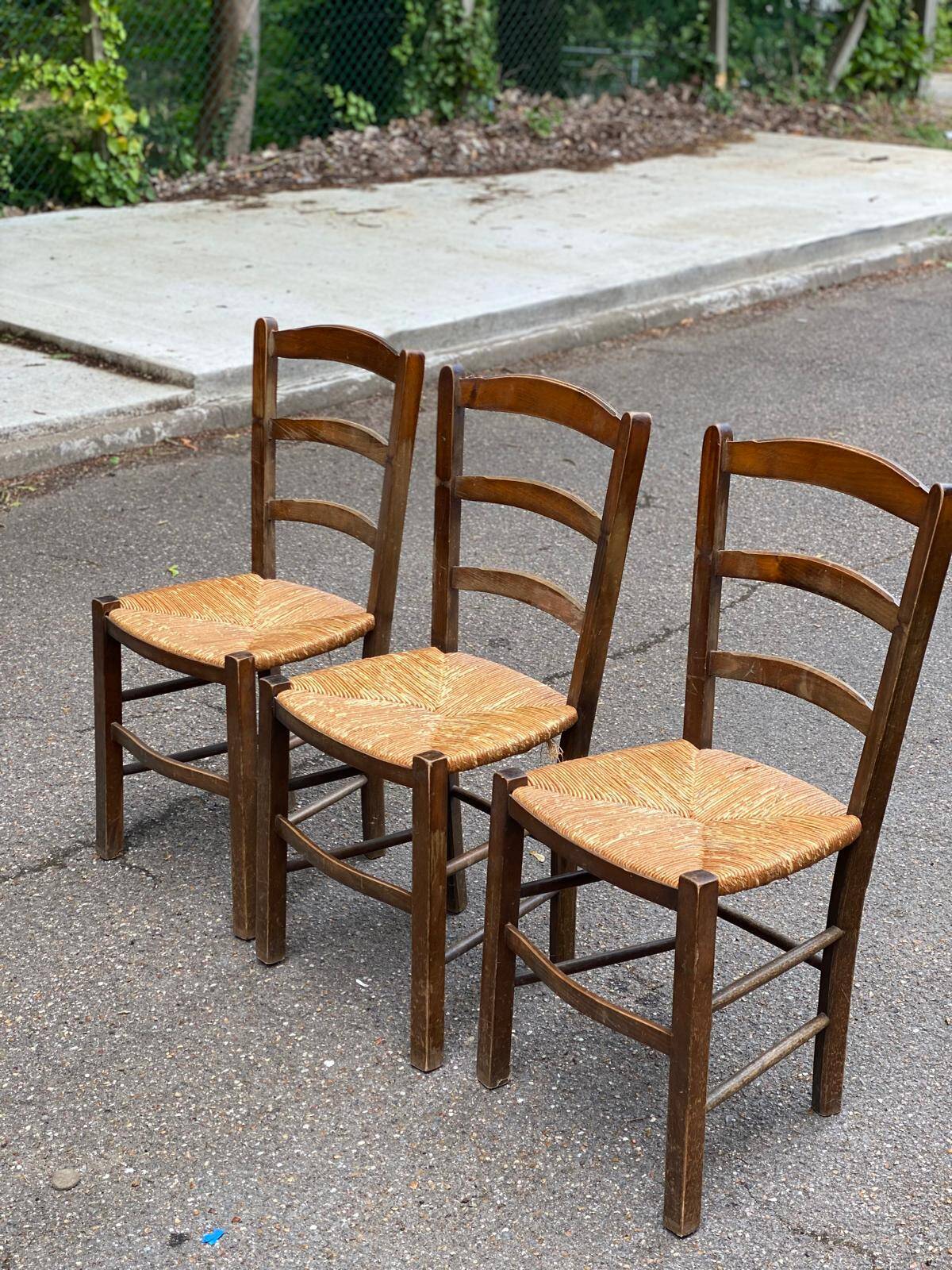 3 solid wood and straw chairs