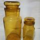 Two amber jars