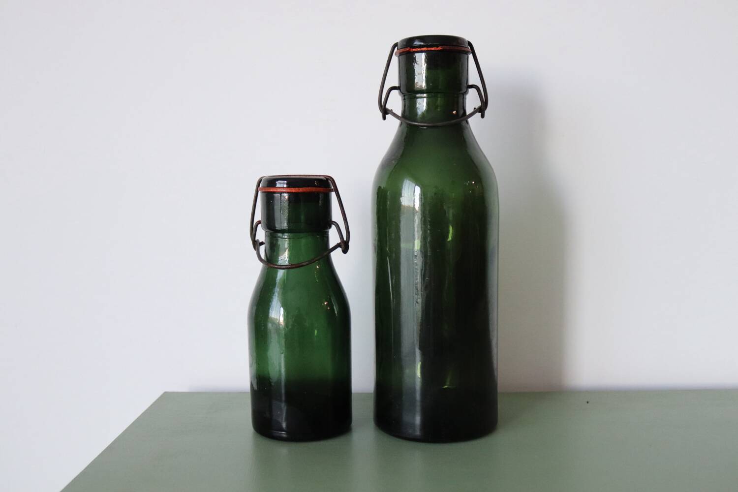 Pair of old green glass jars/bottles – models 1/2 and 1 1/