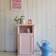 Antique bedside table revamped in pink.