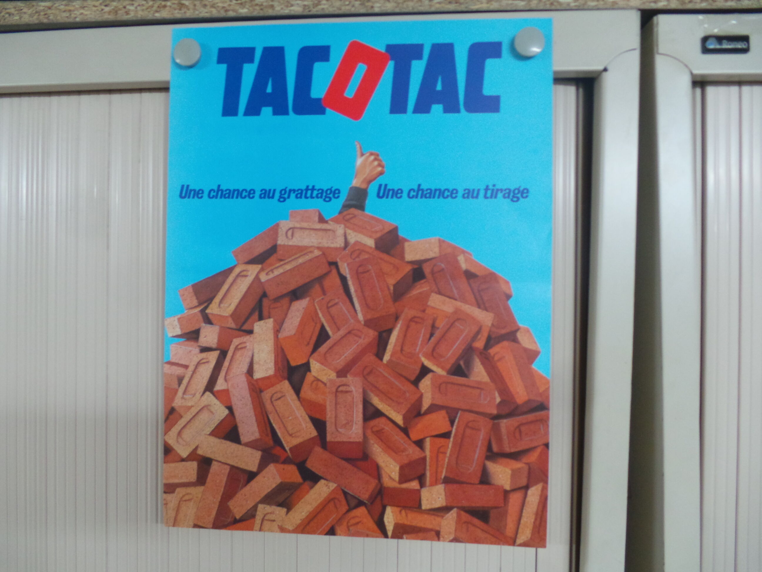 Original National Lottery poster tac o tac a chance at scraping and drawing bricks