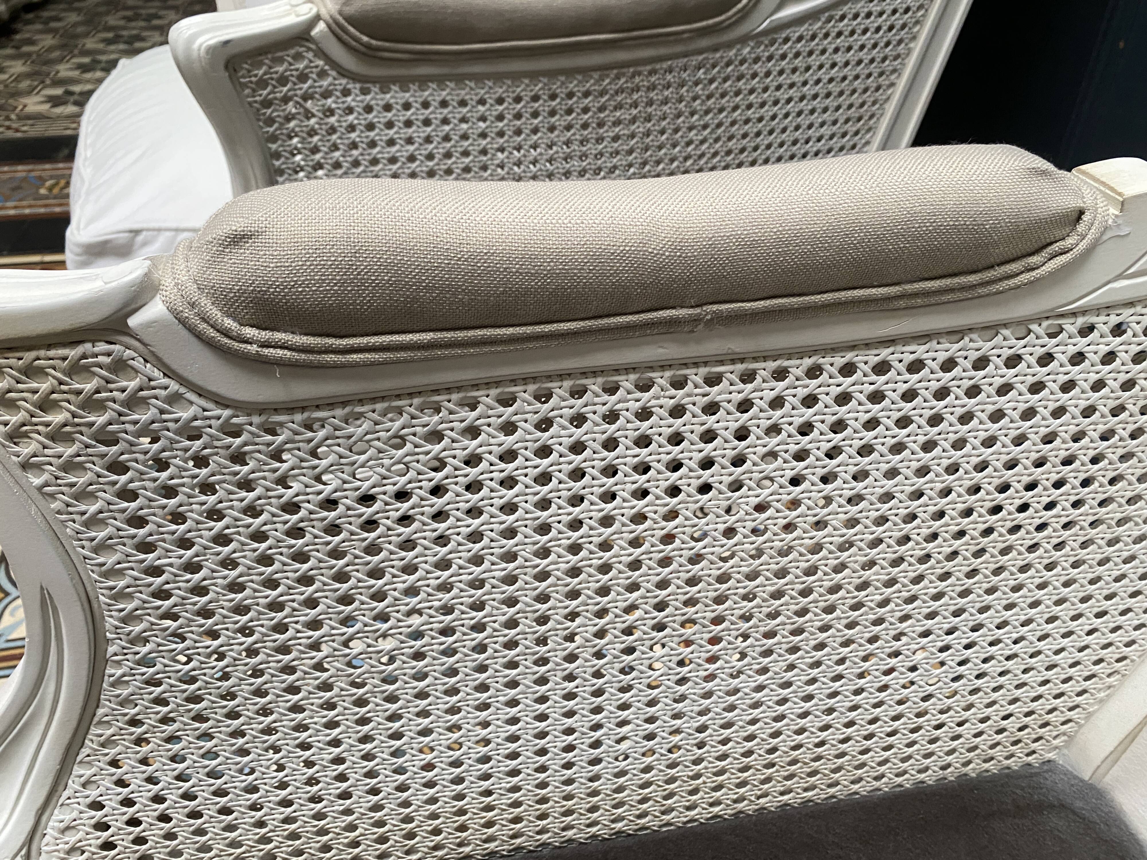 Pair of Louis XVI style caned Bergère armchairs