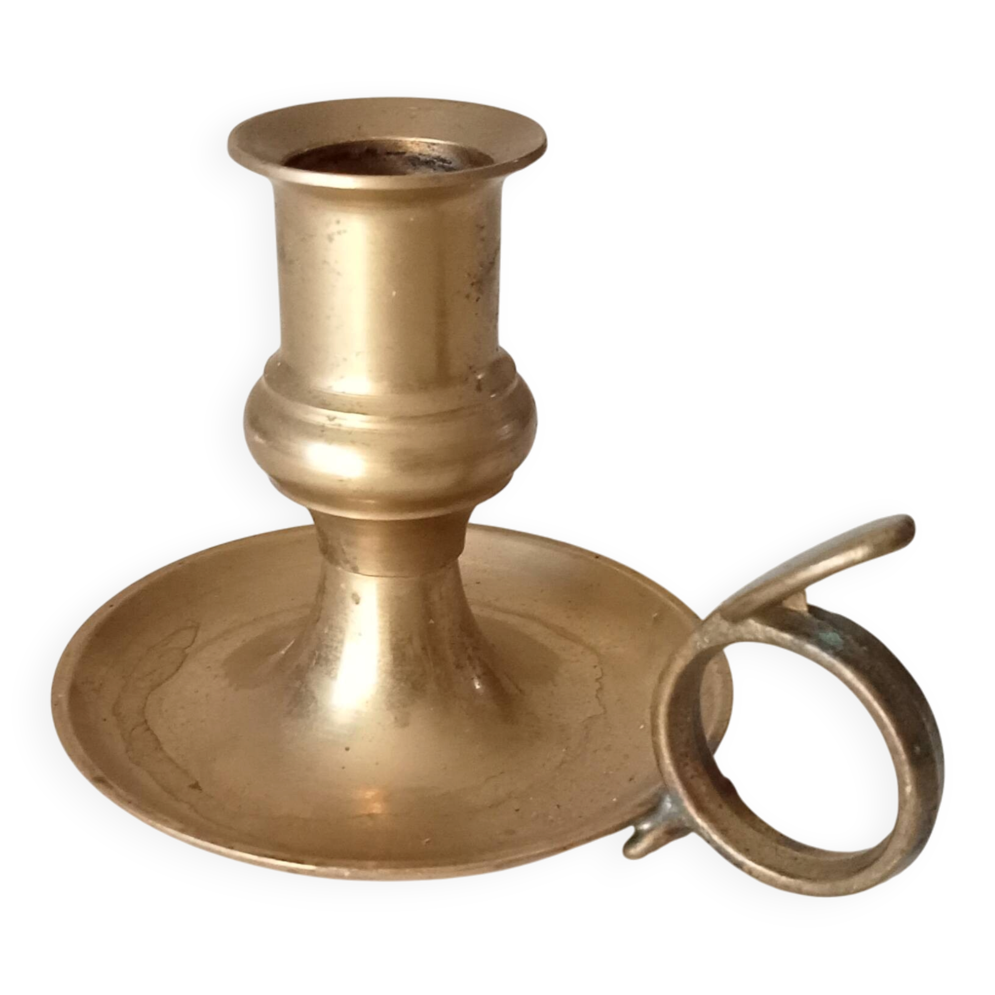 Antique hand candlestick in solid gilded brass.